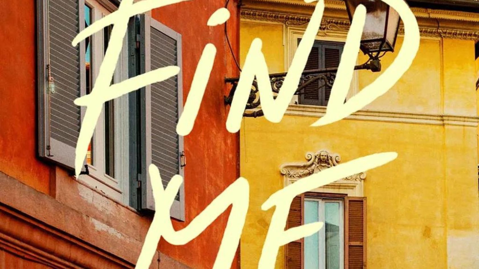 The image showcases a close-up of orange and yellow building facades with windows and shutters, evoking warm climates. The words "FIND ME" are boldly written in cream-colored letters across the scene. | Jacob Warn